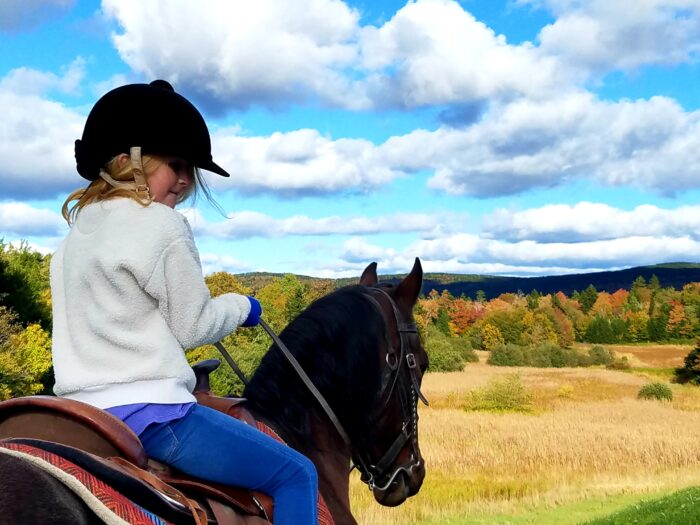 Child riding horse