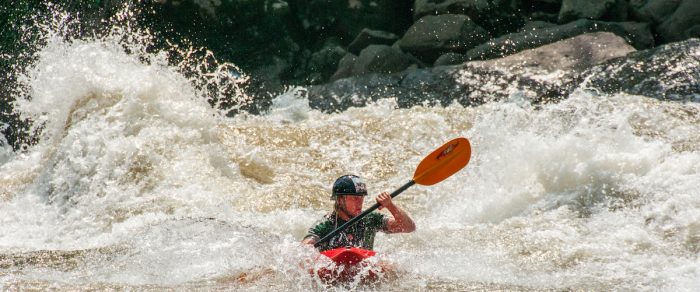 Kayaker in whitewater rapids, West Virginia
