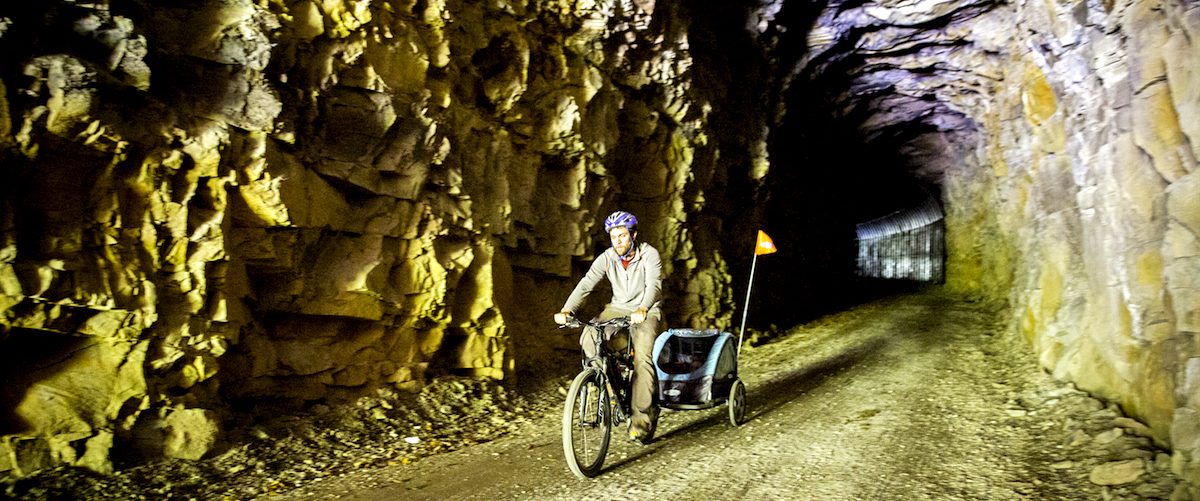 Bike riding through Sharp's Tunnel, Greenbrier River Trail, West Virginia