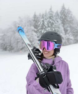 Young woman with skis at Snowshoe Mountain, WV