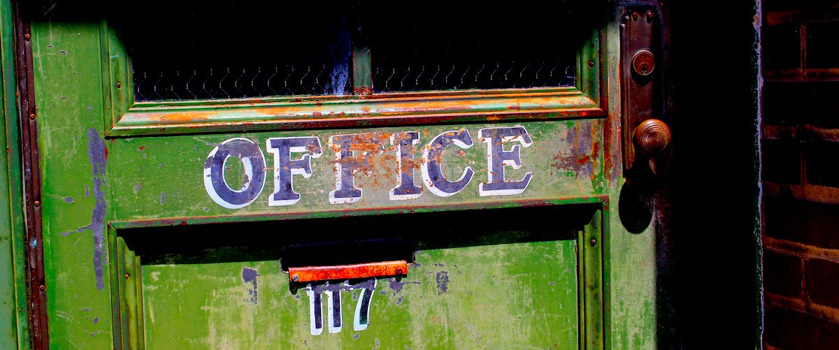 Old green door that reads "office" in purple letters, Hinton, WV