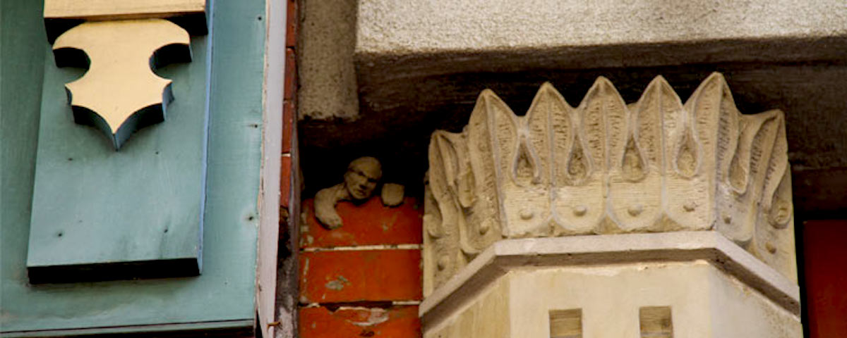 Mortar Man sculpture, squeezed between two buildings in Charleston, West Virginia