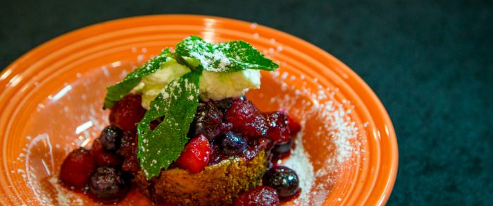 A cake with fresh berries and mint sprig from West Virginia