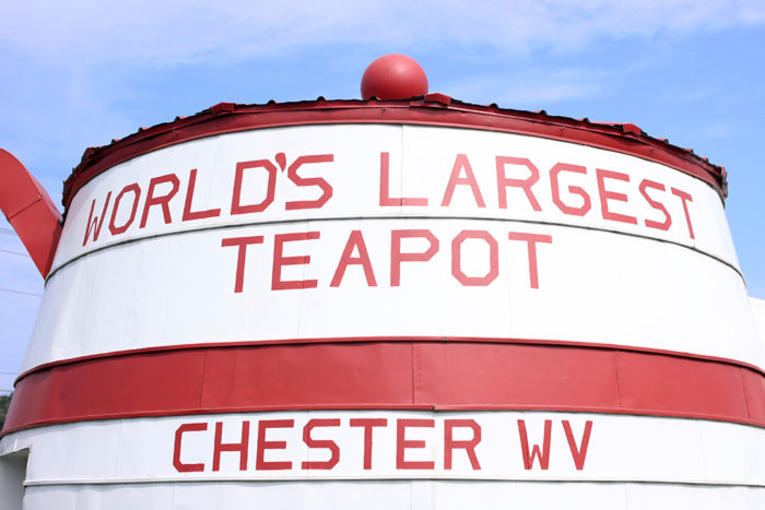 Close up of World's Largest Teapot Chester WV, bright white teapot with red writing