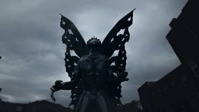 The Mothman statue looms over Point Pleasant with its large wings and red eyes