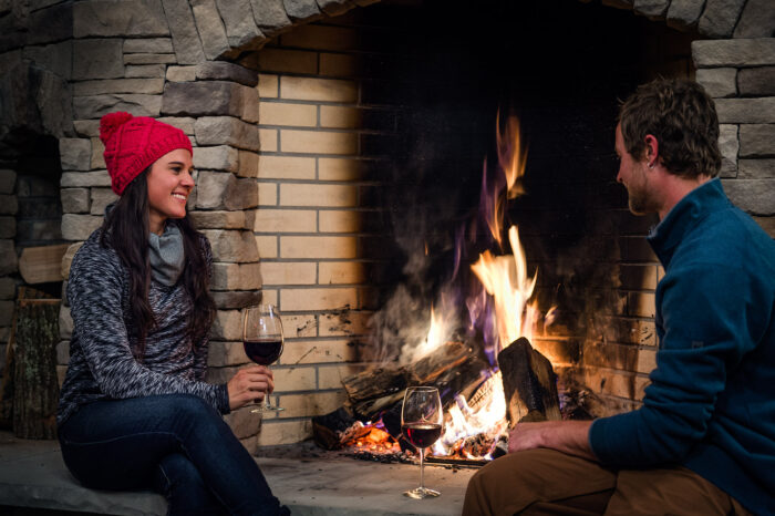 Snowshoe Mountain, Lodge, winter, couple sitting by fireplace